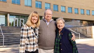 Helen and Robert E. Wright ’67 smile with Dean Joyce Strawser outside of Jubilee Hall